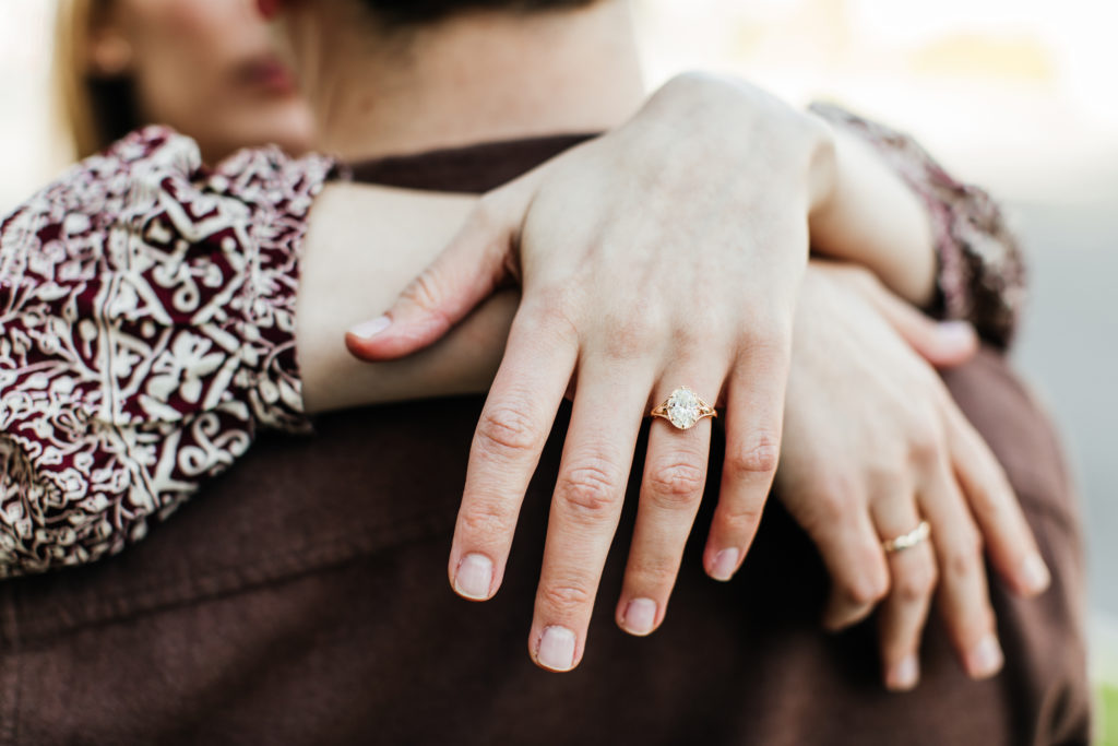 bride wears custom designed engagement ring