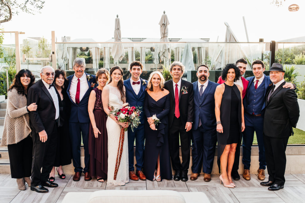 mayfair hotel wedding in downtown Los Angeles picturing posed family portrait at sunset