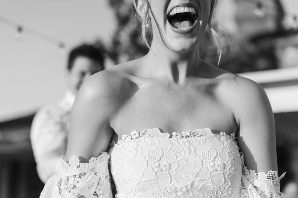 bride's reaction during the hora at her wedding