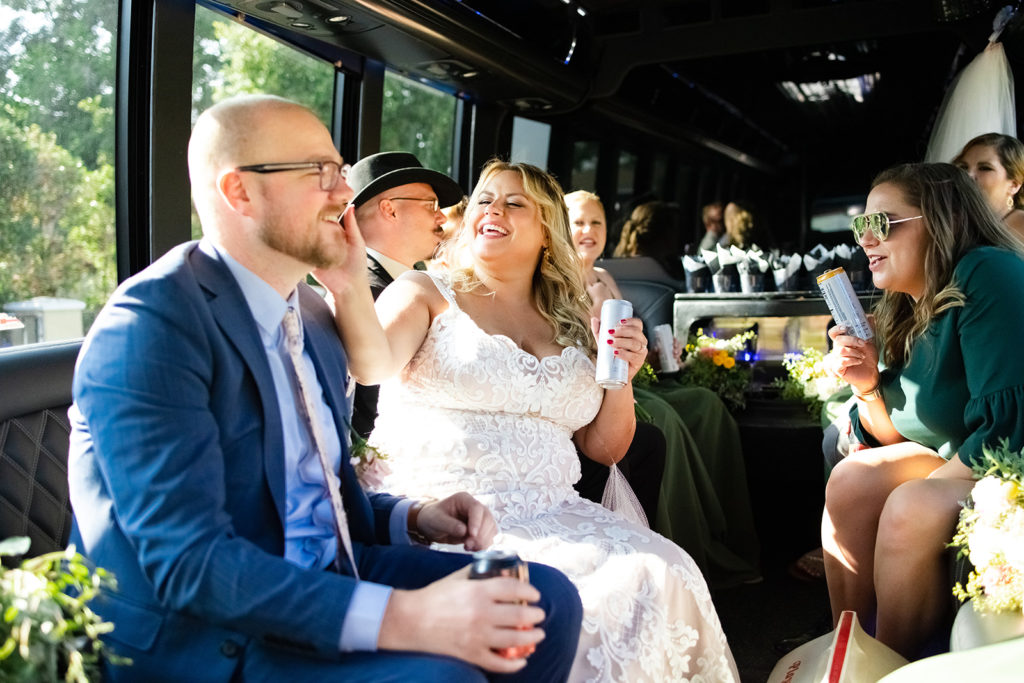 bride and groom in a party bus on their wedding day