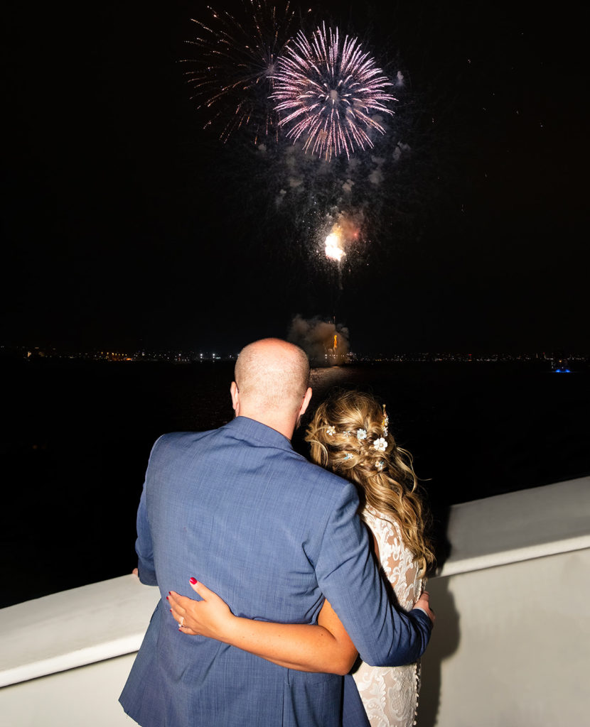bride and groom with fireworks at their wedding