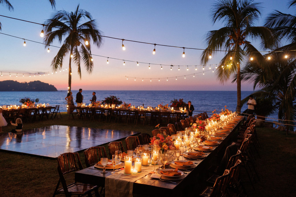 mexico wedding reception at sunset with an ocean view and string lights