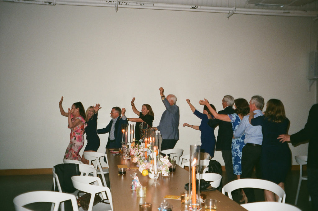 wedding guests dance at reception