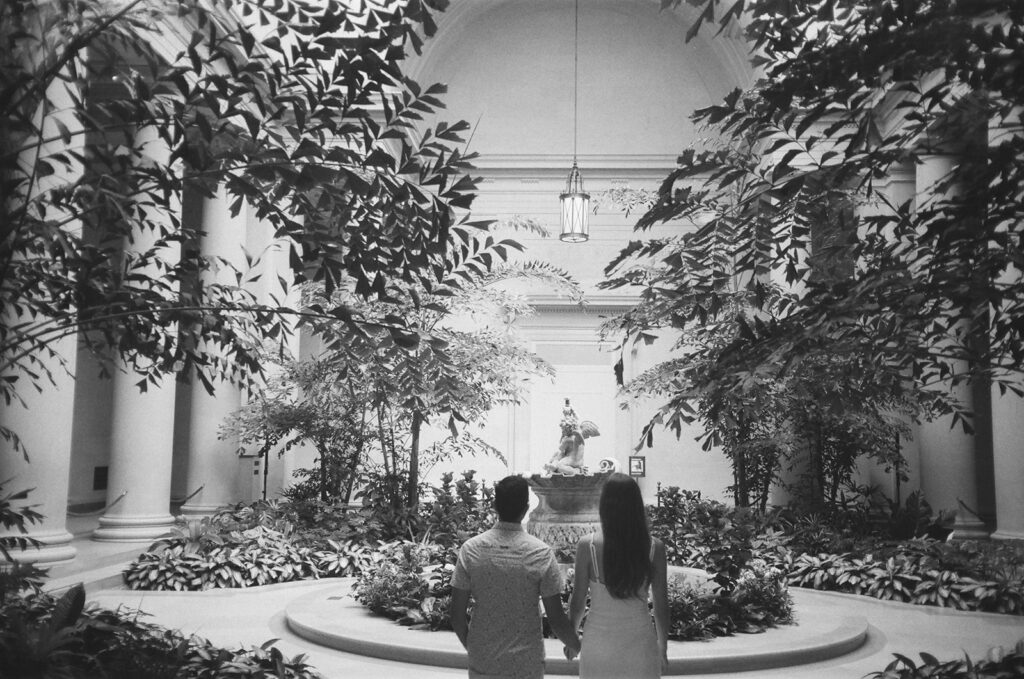 couple enters museum atrium together