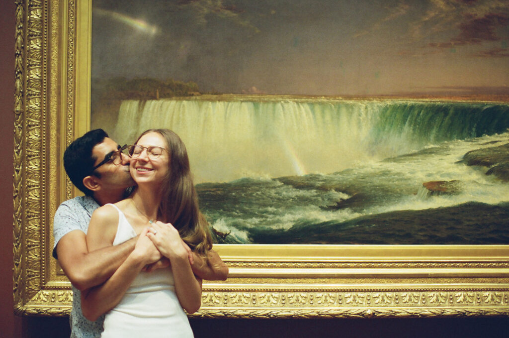 couple embraces in a museum