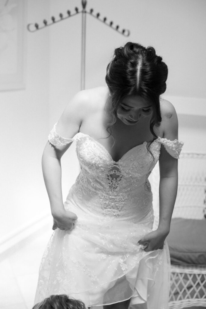 bride getting ready in her wedding dress