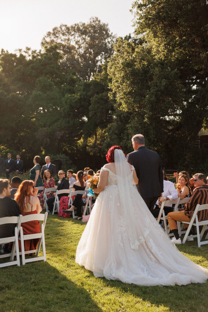 bride walks down the aisle with her father at this Descanso gardens wedding in Los Angeles