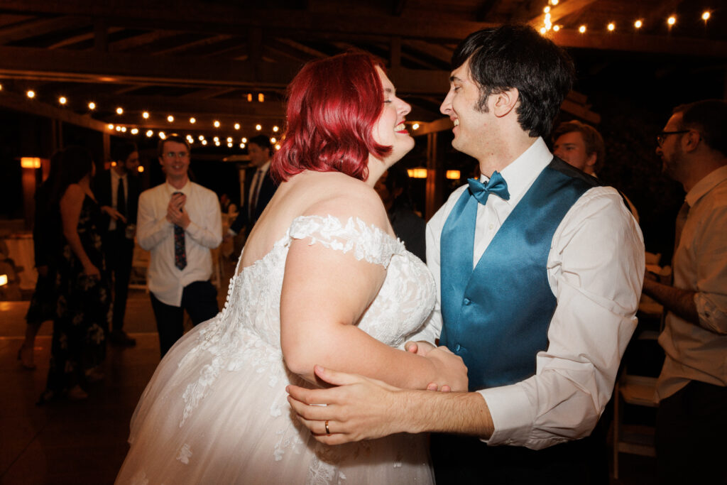 bride and groom dance together at their wedding