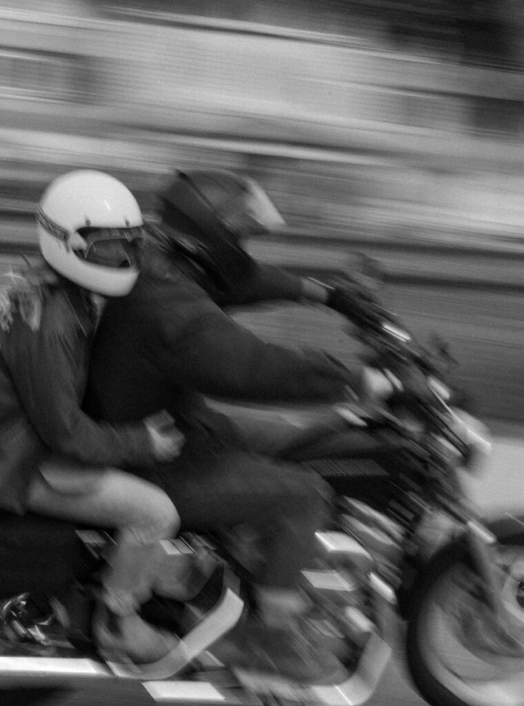 couple rides their motorcycle together