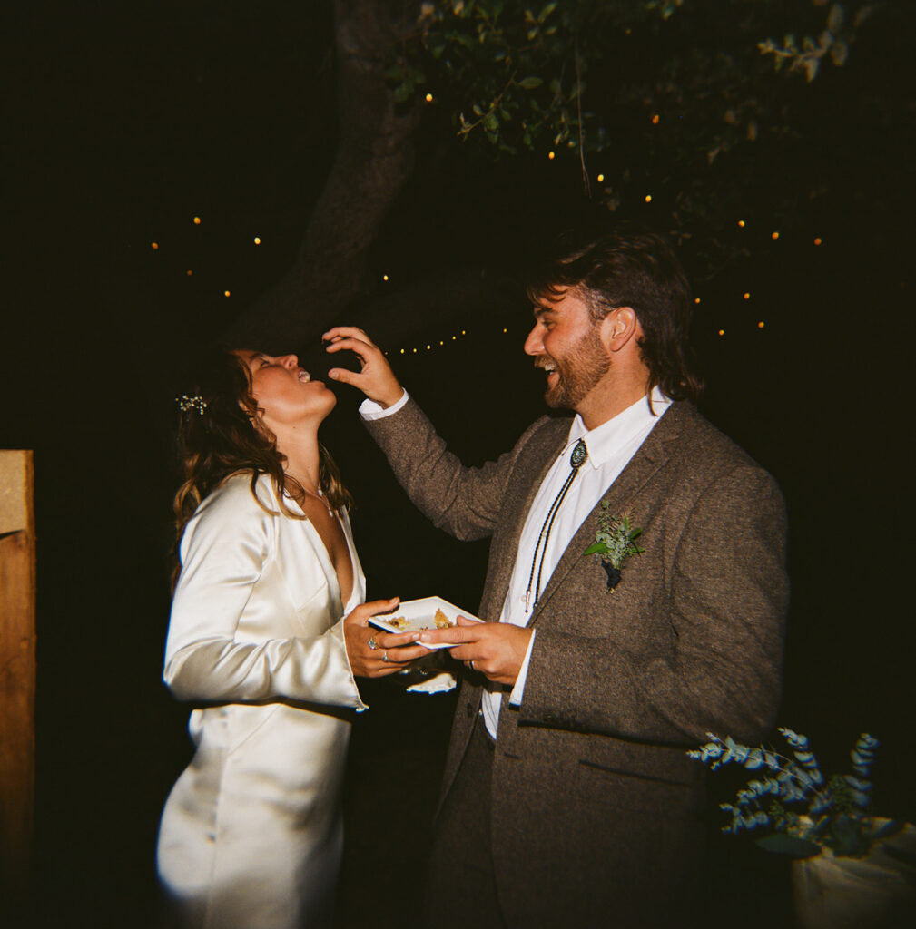 Taking the first bite of their wedding cake! 