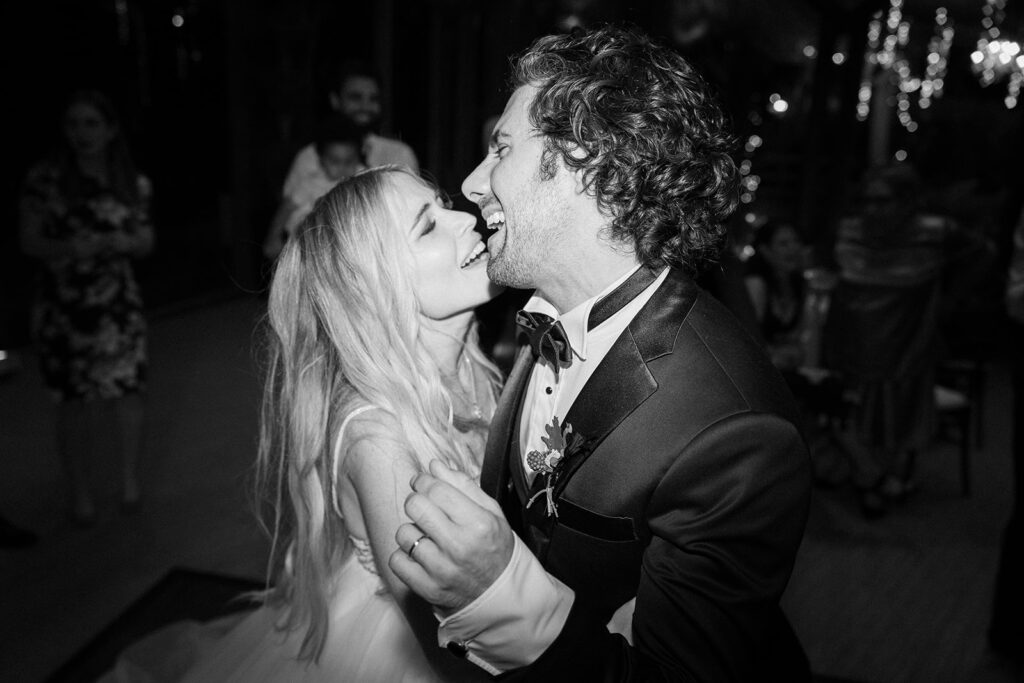 bride and groom dance together at their reception to celebrate their magical wedding day in Malibu
