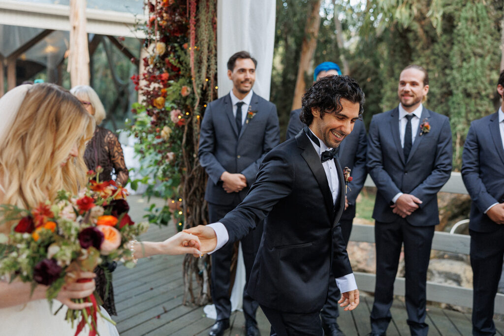 actor Noah James escorts his wife Norma to the altar for their wedding ceremony in Malibu