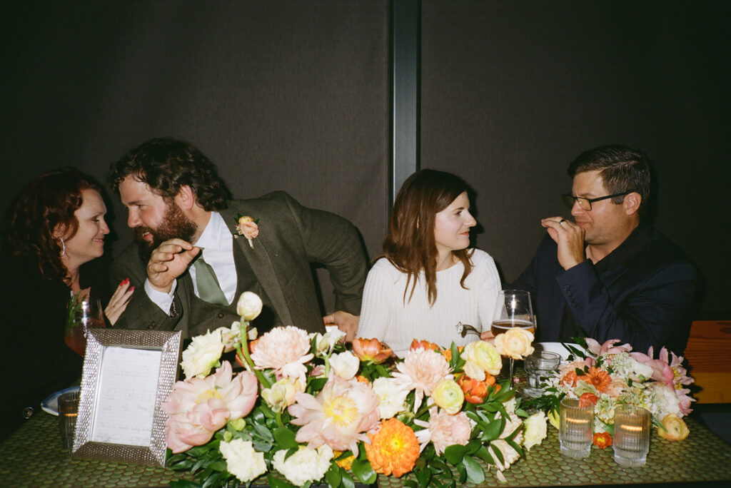 Film photo of bride and groom enjoying their guests 