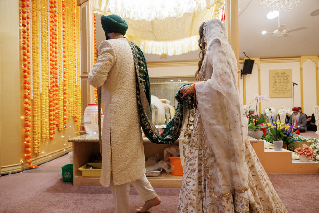 Bride and groom at traditional Sikh ceremony 