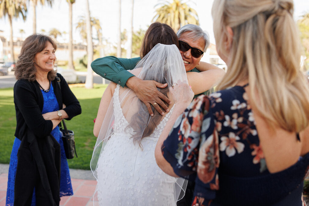 bride hugging guests