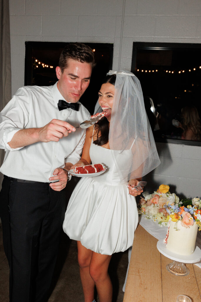 bride and groom enjoying their cake!