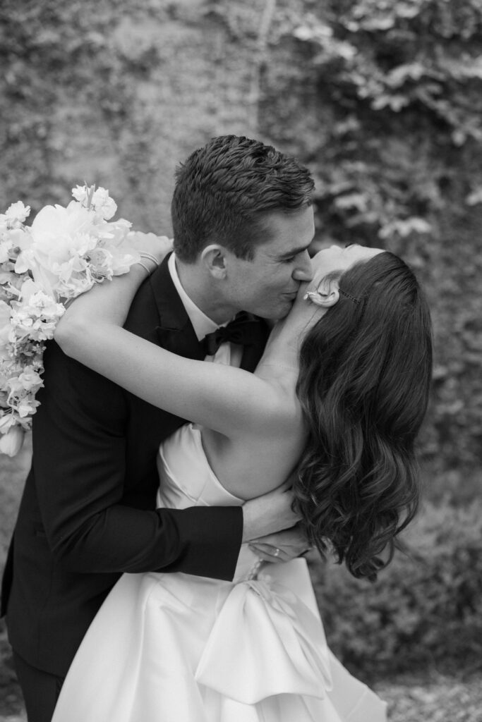 sweet kisses between bride and groom 