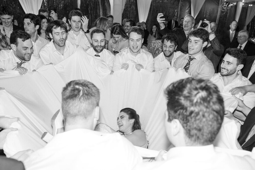 bride being embraced on the dance floor by a sheet! 