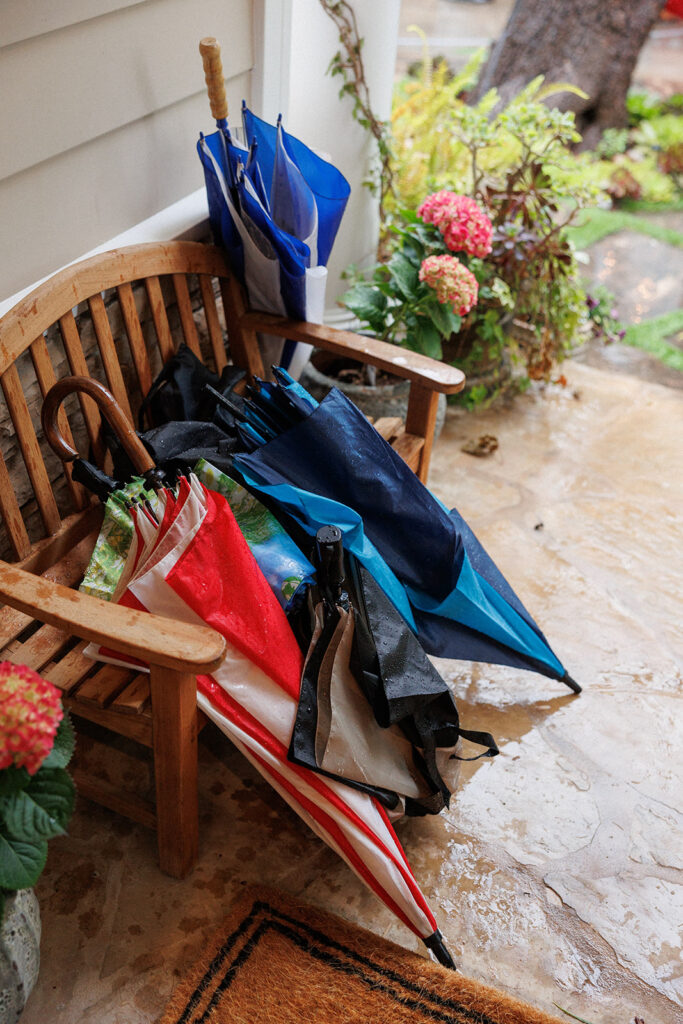 umbrellas at the front porch of home where wedding took place