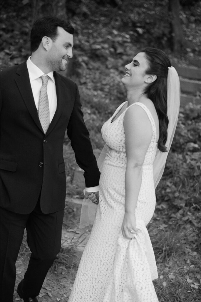 black and white portrait of couple outside in backyard on wedding day 