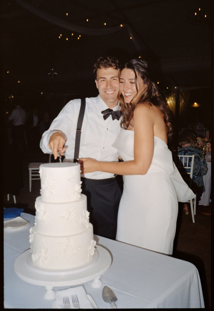 the couple cuts the cake