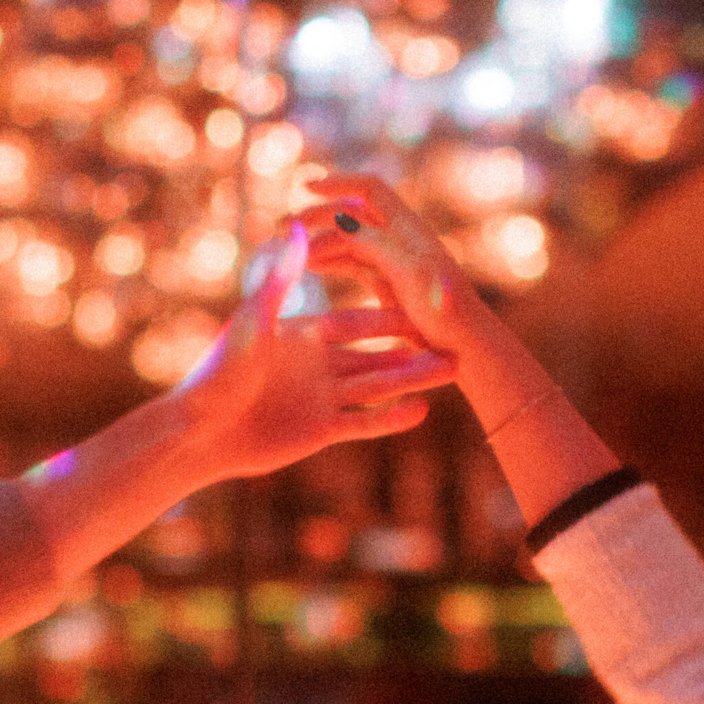 Hands, illuminated light all captured on film. 