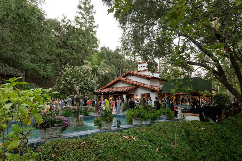 guests mingling around fountain at Rancho Las Lomas wedding cocktail hour