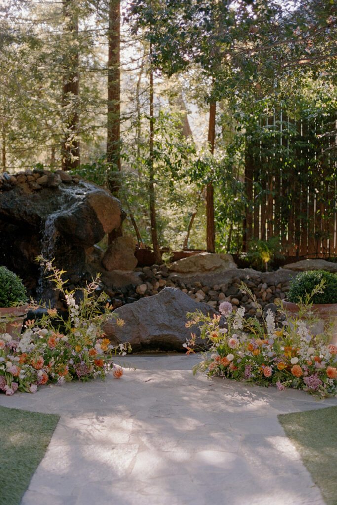 ground floral arrangements frame the ceremony site at Birchwood Room
